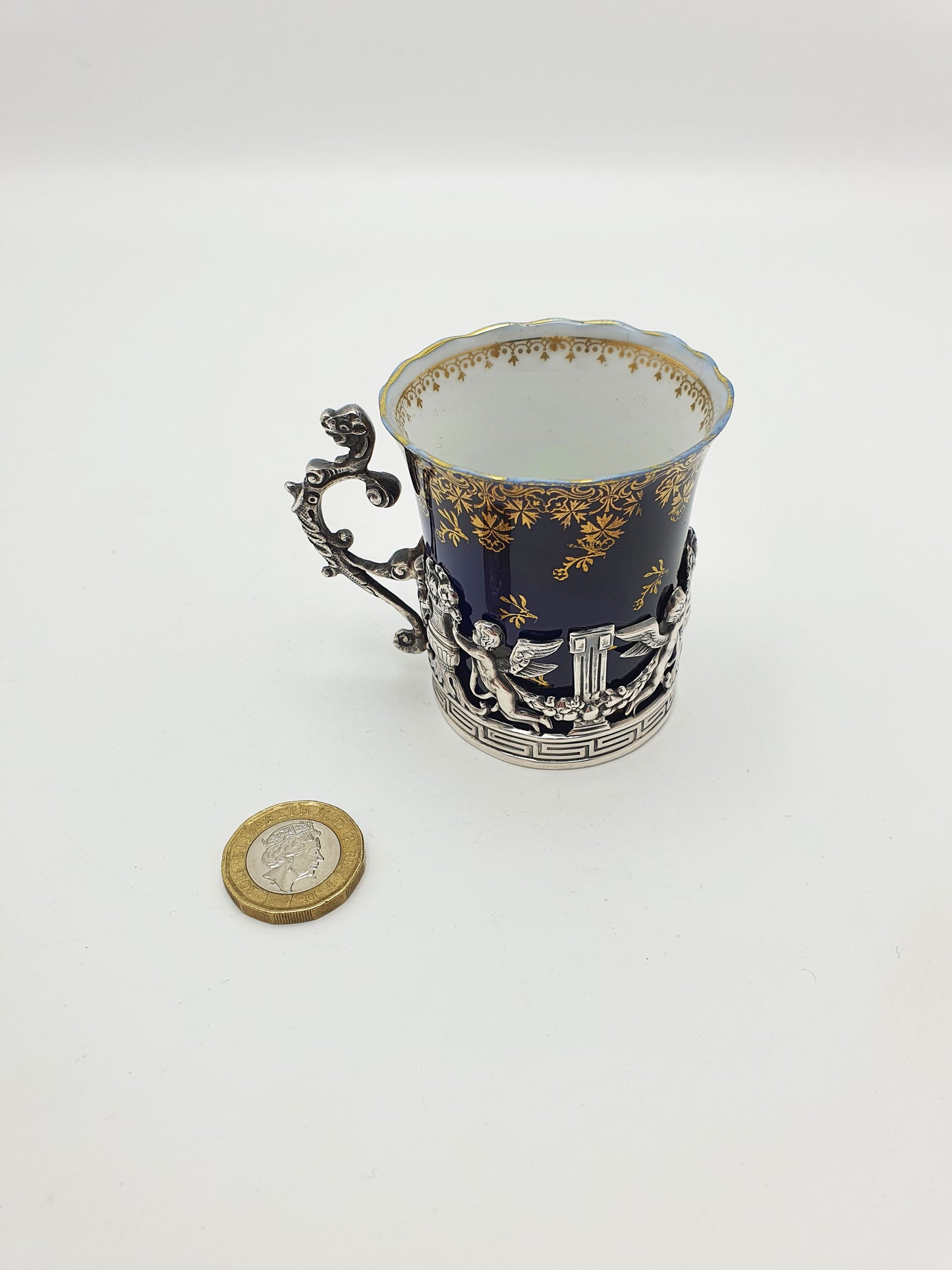 Nice Antique Porcelain and English Silver Coffee Can with Cherub Motif - 1912