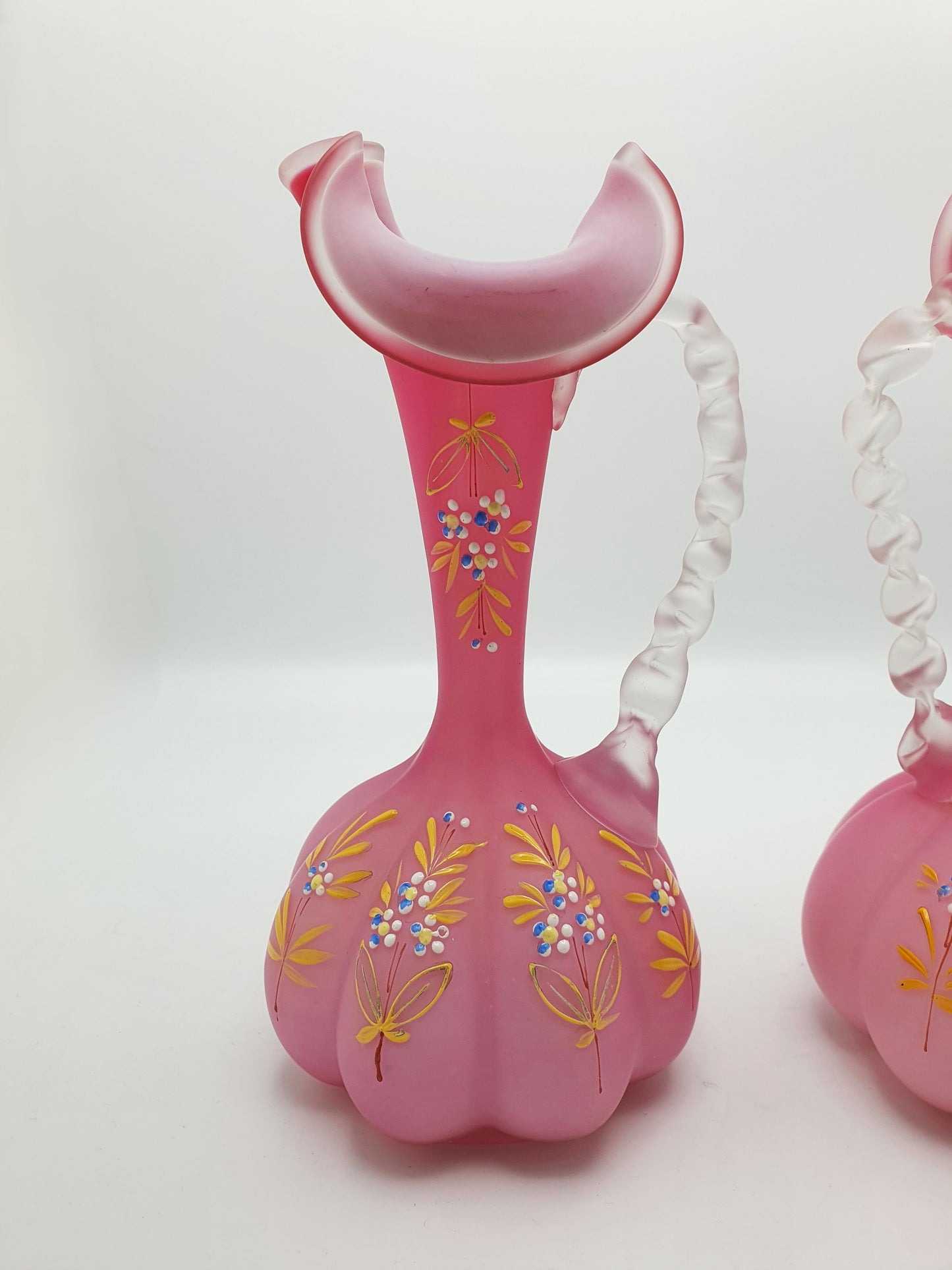 Pair of Victorian Pink Satin Glass Ewers with Enamel Floral Decoration – circa 1890
