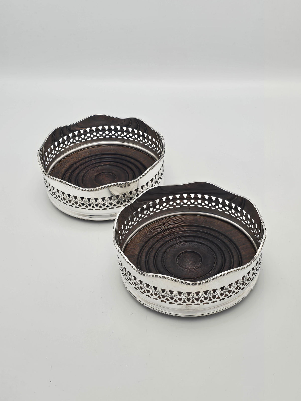 Antique Silver Plated and Mahogany Pierced Wine Bottle Coasters circa 1920
