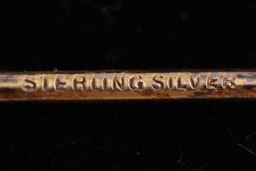 Boxed set of marked sterling silver cocktail sticks.