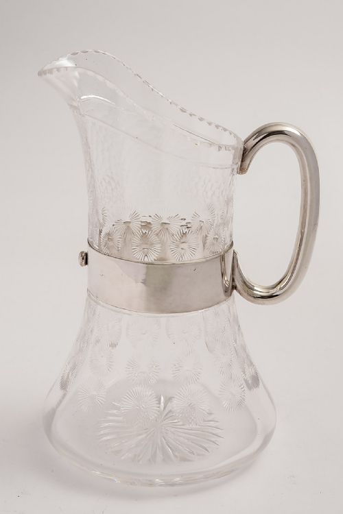 Arts and Crafts 'Christopher Dresser' style silver plated and glass water jug.