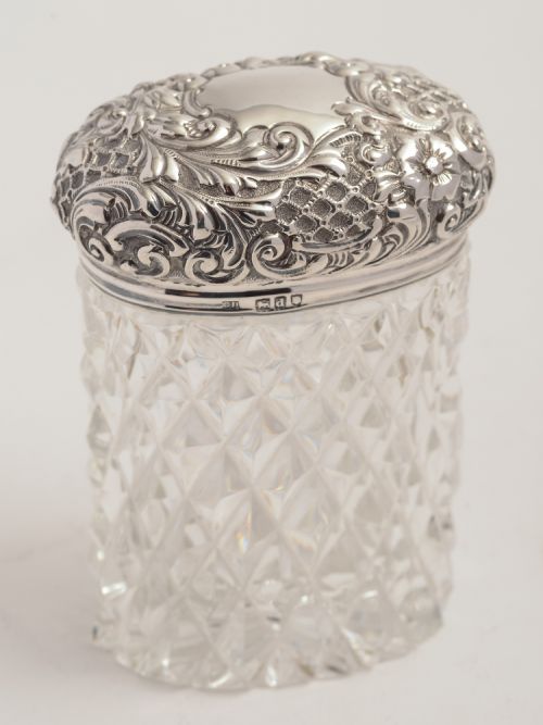 Victorian silver topped cut glass jar.