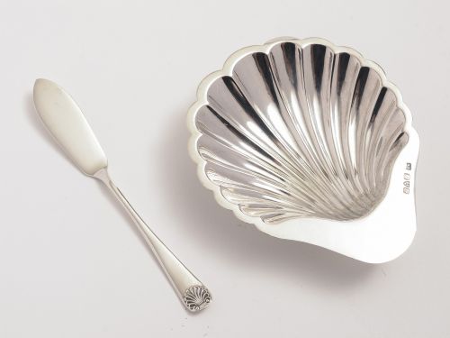 Silver shell shaped butter dish with matching knife