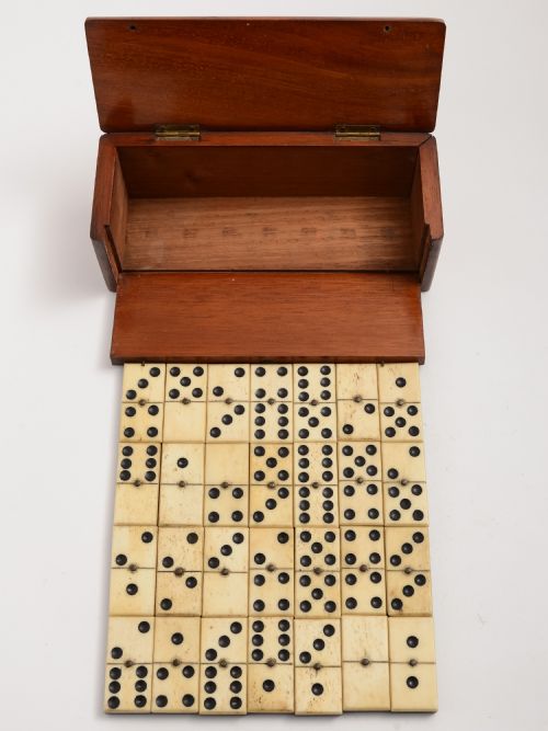 Mahogany boxed bone and ebony dominoes set
