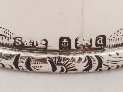 A pair of Edwardian silver napkin rings