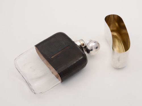 A large Edwardian crocodile leather hip flask