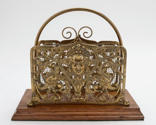 Victorian cast brass letter rack with oak base