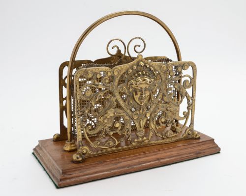 Victorian cast brass letter rack with oak base