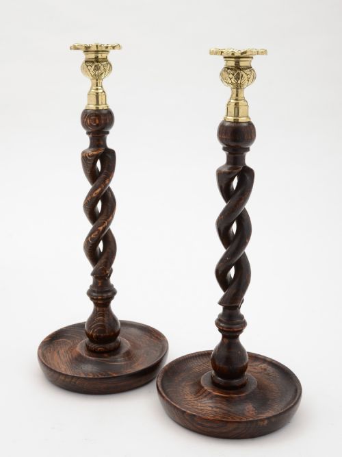 Pair of English Edwardian oak open barley twist candlesticks