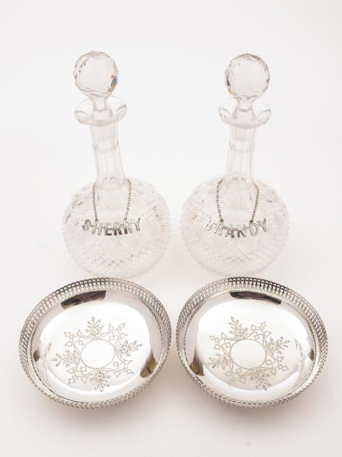 Pair of Cut Glass Decanters with Coasters Circa 1890