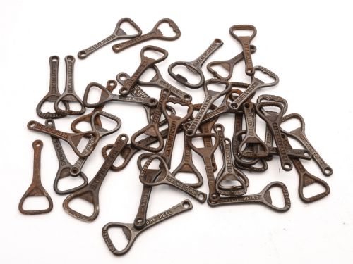 Collection of 40 Advertising Cast Iron Bottle Openers Circa 1920